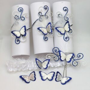 Bijoux de mariage papillons blanc, bleu roi et argent.