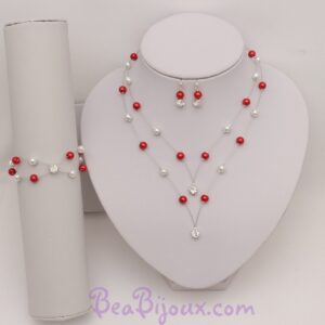 Parure complète PA1276A composée d'un collier en pointe, d'un bracelet et de boucles d'oreilles en perles nacrées rouges et blanches.